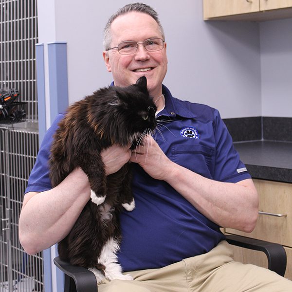 man holding a cat