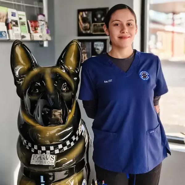 Rae posing with german shepherd statue